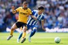 Wolverhampton Wanderers' Joao Gomes, left, and Brighton and Hove Albion's Kaoru Mitoma in action during the English Premier League soccer match between Brighton and Hove Albion and Wolverhampton Wanderers in Brighton, England, Saturday May 9, 2026. (John Walton/PA via AP)