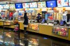 A movie goer stands at the concessions kiosk in the lobby of a Cineplex theatre in Toronto, on Tuesday, Oct. 6, 2020. THE CANADIAN PRESS/Chris Young