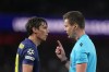 Referee Daniel Siebert speaks to Atletico Madrid's Robin Le Normand during a Champions League semifinal, second leg, soccer match between Arsenal FC and Atletico Madrid in London, Tuesday, May 5, 2026. (AP Photo/Alastair Grant)