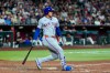 New York Mets' Juan Soto grimaces after a swinging strike during the eighth inning of a baseball game against the Arizona Diamondbacks, Saturday, May 9, 2026, in Phoenix. (AP Photo/Ross D. Franklin)