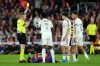 Referee Alejandro Jose Hernandez Hernandez shows a yellow card to Real Madrid's Trent Alexander-Arnold, right, during the Spanish La Liga soccer match between FC Barcelona and Real Madrid in Barcelona, Spain, Sunday, May 10, 2026. (AP Photo/Joan Mateu Parra)