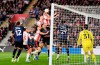 Southampton's Ross Stewart, top, scores their first goal of the game during the EFL Championship play off semifinal soccer game between Southampton and Middlesbrough, Tuesday, May 12, 2026, in, Southampton, England. (Andrew Matthews/PA via AP)