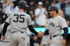 New York Yankees' Trent Grisham, right, celebrates with Cody Bellinger after hitting a three-run home run during the third inning of a baseball game against the Baltimore Orioles, Tuesday, May 12, 2026, in Baltimore. (AP Photo/Stephanie Scarbrough)
