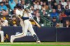 Milwaukee Brewers' Joey Ortiz hits a solo home run during the third inning of a baseball game against the San Diego Padres, Tuesday, May 12, 2026, in Milwaukee. (AP Photo/Aaron Gash)