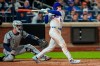New York Mets' A.J. Ewing (9) hits an RBI triple during the seventh inning of a baseball game against the Detroit Tigers, Tuesday, May 12, 2026, in New York. (AP Photo/Yuki Iwamura)