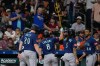 Seattle Mariners' Dominic Canzone (8) celebrates after hitting a grand slam against the Houston Astros during the fourth inning of a baseball game Tuesday, May 12, 2026, in Houston. (AP Photo/David J. Phillip)