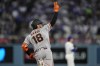 San Francisco Giants' Eric Haase, gestures as he rounds first after hitting a solo home run during the third inning of a baseball game against the Los Angeles Dodgers, Tuesday, May 12, 2026, in Los Angeles. (AP Photo/Mark J. Terrill)