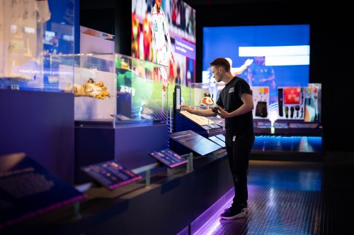 A worker sets up a display of World Cup history during a tour of a FIFA Museum exhibit at Science World in Vancouver, on Wednesday, May 13, 2026. THE CANADIAN PRESS/Ethan Cairns