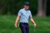Luke Donald, of England, smiles on the first green during a PGA Championship golf tournament practice round at Aronimink Golf Club, Wednesday, May 13, 2026, in Newtown Square, PA. (AP Photo/Matt Slocum)