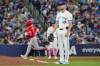 Toronto Blue Jays pitcher Eric Lauer looks on as Los Angeles Angels second baseman Oswald Peraza (2) rounds the bases after hitting a two run home run during the top of the fifth inning MLB baseball action in Toronto on Sunday, May 10, 2026. THE CANADIAN PRESS/Frank Gunn