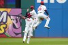 Cleveland Guardians' outfielders, Petey Halpin, left, Angel Martínez, center, and Chase DeLauter (24) celebrate after the Guardians defeated the Los Angeles Angels in a baseball game in Cleveland, Wednesday, May 13, 2026. (AP Photo/Sue Ogrocki)