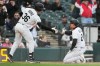Chicago White Sox's Jarred Kelenic, right, celebrates with Drew Romo after scoring on a one-run double by Tristan Peters during the second inning of a baseball game against the Kansas City Royals in Chicago, Wednesday, May 13, 2026. (AP Photo/Nam Y. Huh)