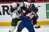 Minnesota Wild defenseman Jake Middleton, left, checks Colorado Avalanche left wing Joel Kiviranta in the first period of Game 5 of an NHL Stanley Cup hockey second-round playoff series, Wednesday, May 13, 2026, in Denver. (AP Photo/David Zalubowski)