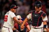 Atlanta Braves pitcher Raisel Iglesias celebrates a win over the Chicago Cubs with Drake Baldwin after a baseball game, Wednesday, May 13, 2026, in Atlanta. (AP Photo/Mike Stewart)