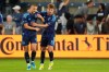 Sporting Kansas City forward Dejan Joveljic (9) and defender Jake Davis (8) celebrate after Joveljic scored a goal during the first half of an MLS soccer match against LA Galaxy, Wednesday, May 13, 2026, in Kansas City, Kan. (AP Photo/Charlie Riedel)