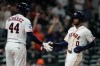 Houston Astros' Brice Matthews (0) celebrates with Yordan Alvarez after scoring during the eighth inning of a baseball game against the Seattle Mariners in Houston, Wednesday, May 13, 2026. (AP Photo/Ashley Landis)