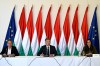 Hungarian Prime Minister Peter Magyar, centre, attends the first, out-of-town cabinet meeting of the new Tisza government flanked by Balint Ruff, Head of the Prime Minister's Office, and Foreign Minister Anita Orban, right, in the Opusztaszer National Historical Memorial Park in Opusztaszer, Hungary, Wednesday, May 13, 2026. (Robert Hegedus/MTI via AP)