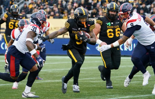 Hamilton Tiger Cats running back Greg Bell (5) runs during first half CFL East Final football game action against the Montreal Alouettes, in Hamilton, Ont., Saturday, Nov. 8, 2025. THE CANADIAN PRESS/Peter Power