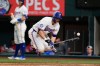 Texas Rangers' Corey Seager reacts to being hit by a pitch in the ninth inning of a baseball game against the Arizona Diamondbacks Monday, May 11, 2026, in Arlington, Texas. (AP Photo/Tony Gutierrez)