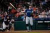 Seattle Mariners' Cal Raleigh (29) strikes out swinging as Houston Astros catcher Christian Vázquez kneels behind home plate during the third inning of a baseball game Tuesday, May 12, 2026, in Houston. (AP Photo/David J. Phillip)