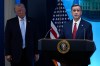 FILE - CIA Director John Ratcliffe, accompanied by President Donald Trump, speaks with reporters in the James Brady Press Briefing Room at the White House in Washington, April 6, 2026, File)