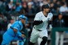 Chicago White Sox's Randal Grichuk (34) takes off after hitting a two-run single during the third inning of a baseball game against the Kansas City Royals, Thursday, May 14, 2026, in Chicago. (AP Photo/Erin Hooley)