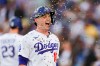 Los Angeles Dodgers designated hitter Will Smith has sunflower seeds thrown at him after hitting a solo home run during the first inning of a baseball game against the San Francisco Giants, Thursday, May 14, 2026, in Los Angeles. (AP Photo/Ryan Sun)