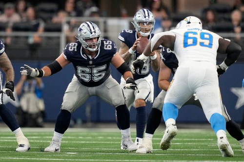 Dallas Cowboys offensive tackle Dakoda Shepley (65) defends against a rush by Los Angeles Chargers' CJ Okoye (69) during a pre-season NFL football game, Saturday, Aug. 24, 2024, in Arlington, Texas. (AP Photo/Tony Gutierrez)