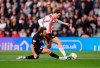 Middlesbrough's Aidan Morris, left, and Southampton's Caspar Jander battle for the ball during the EFL Championship play off semifinal soccer game between Southampton and Middlesbrough, Tuesday, May 12, 2026, in, Southampton, England. (Andrew Matthews/PA via AP)