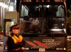A police officer stands next to the damaged Chilean team bus after an altercation between police and Chilean players outside BMO Field following the semifinal of the FIFA U-20 World Cup on July 19, 2007 in Toronto. (CP PHOTO/Nathan Denette)