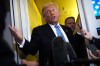 President Donald Trump speaks to reporters aboard Air Force One, Friday, May 15, 2026, as he returns from a trip to Beijing, China. (AP Photo/Mark Schiefelbein)
