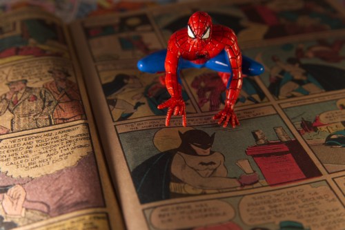 A Spiderman figurine sits atop a facsimile copy of the May 1939 Detective Comics anthology series in Phoenix, Thursday May 14, 2026. This issue made history for including the debut of the Batman superhero in a story called 