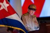 FILE - Former Cuban President Raul Castro looks at the Cuban flag during his speech at the event celebrating the 65th anniversary of the triumph of the revolution in Santiago, Cuba, Jan. 1, 2024. (AP Photo/Ismael Francisco, File)
