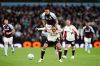 Liverpool's Virgil van Dijk, front, tries to block Aston Villa's Morgan Rogers from the ball during the English Premier League soccer match between Aston Villa and Liverpool in Birmingham, England, Friday, May 15, 2026. (Jacob King/PA via AP)