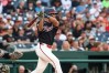Washington Nationals' Daylen Lile follows through on his swing after hitting a double against Baltimore Orioles pitcher Shane Baz during the second inning of a baseball game, Friday, May 15, 2026, in Washington. (AP Photo/Terrance Williams)