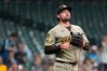 San Diego Padres' Matt Waldron looks on during the fourth inning of a baseball game against the Milwaukee Brewers, Tuesday, May 12, 2026, in Milwaukee. (AP Photo/Aaron Gash)