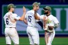 Tampa Bay Rays center fielder Cedric Mullins celebrates with shortstop Taylor Walls (6) and second baseman Ben Williamson (15) after the team defeated the Miami Marlins during a baseball game Friday, May 15, 2026, in St. Petersburg, Fla. (AP Photo/Chris O'Meara)