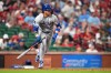Kansas City Royals' Bobby Witt Jr. follows through on and RBI double during the 10th inning of a baseball game against the St. Louis Cardinals Friday, May 15, 2026, in St. Louis. (AP Photo/Jeff Roberson)
