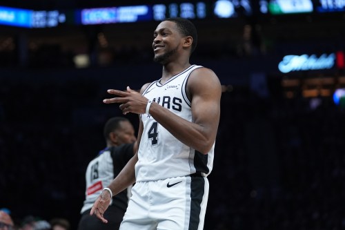 San Antonio Spurs guard De'aaron Fox (4) reacts after scoring against the Minnesota Timberwolves during the second half of Game 6 of an NBA basketball second-round playoffs series in Minneapolis, Friday, May 15, 2026. (AP Photo/Abbie Parr)
