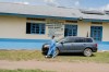 A health worker wearing protective gear walks outside the a hospital in Bunia, Congo, Saturday, May 16, 2026. (AP Photo/Jorkim Jotham Pituwa)