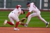 Boston Red Sox third baseman Caleb Durbin, left, fields a ground out by Philadelphia Phillies' Trea Turner, as shortstop Trevor Story (10) backs him up, during the first inning of a baseball game, Thursday, May 14, 2026, in Boston. (AP Photo/Charles Krupa)