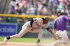 Arizona Diamondbacks shortstop Geraldo Perdomo, left, applies the late tag as Colorado Rockies' Jake McCarthy safely steals second base in the seventh inning of a baseball game Saturday, May 16, 2026, in Denver. (AP Photo/David Zalubowski)