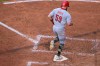 Cincinnati Reds' Blake Dunn scores a run during the fifth inning of a baseball game against the Cleveland Guardians, Saturday, May 16, 2026, in Cleveland. (AP Photo/David Dermer)