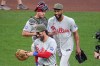 Philadelphia Phillies pitcher Cristopher Sanchez, right, celebrates with catcher J.T. Realmuto, top left, and Bryce Harper, bottom left, after getting the final out of a baseball game against the Pittsburgh Pirates in Pittsburgh, Saturday, May 16, 2026. (AP Photo/Gene J. Puskar)