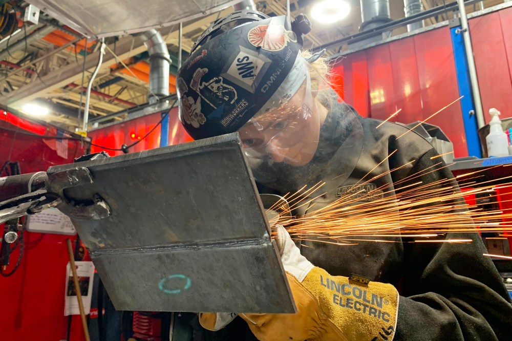 Student Mikala Sposito welds at Washtenaw Community College on Friday, May 1, 2026, in Ann Arbor., Mich. (AP Photo/Mike Householder)