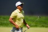 Kurt Kitayama walks across the first green after his shot during the third round of the PGA Championship golf tournament at Aronimink Golf Club, Saturday, May 16, 2026, in Newtown Square, PA. (AP Photo/Matt Slocum)