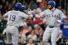 Texas Rangers' Jake Burger, right, celebrates with Alejandro Osuna (19) after hitting a two-run home run against the Houston Astros during the fifth inning of a baseball game, Sunday, May 17, 2026, in Houston. (AP Photo/Eric Christian Smith)
