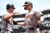 Baltimore Orioles' Gunnar Henderson, right, celebrates after his home run with Tyler O'Neill, left, during the first inning of a baseball game against the Washington Nationals, Sunday, May 17, 2026, in Washington. (AP Photo/Nick Wass)