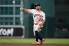 Houston Astros second baseman Jose Altuve throws to first to out Seattle Mariners' J.P. Crawford during the third inning of a baseball game in Houston, Wednesday, May 13, 2026. (AP Photo/Ashley Landis)