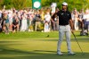 Aaron Rai, of England, waves after his round on the 18th green during the final round of the PGA Championship golf tournament at Aronimink Golf Club, Sunday, May 17, 2026, in Newtown Square, PA. (AP Photo/Carolyn Kaster)